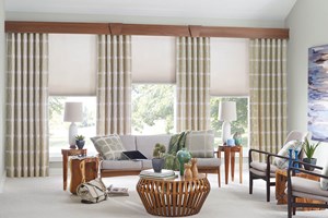 Living room with Bali 3⁄8 inch Double Cell Cellular Shades, Drapery, and Noble Wood Cornices